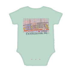 Mint green infant bodysuit with Charleston harbor print: Ravenel Bridge, Battery houses, sailboat and dolphins, reading Charleston, SC